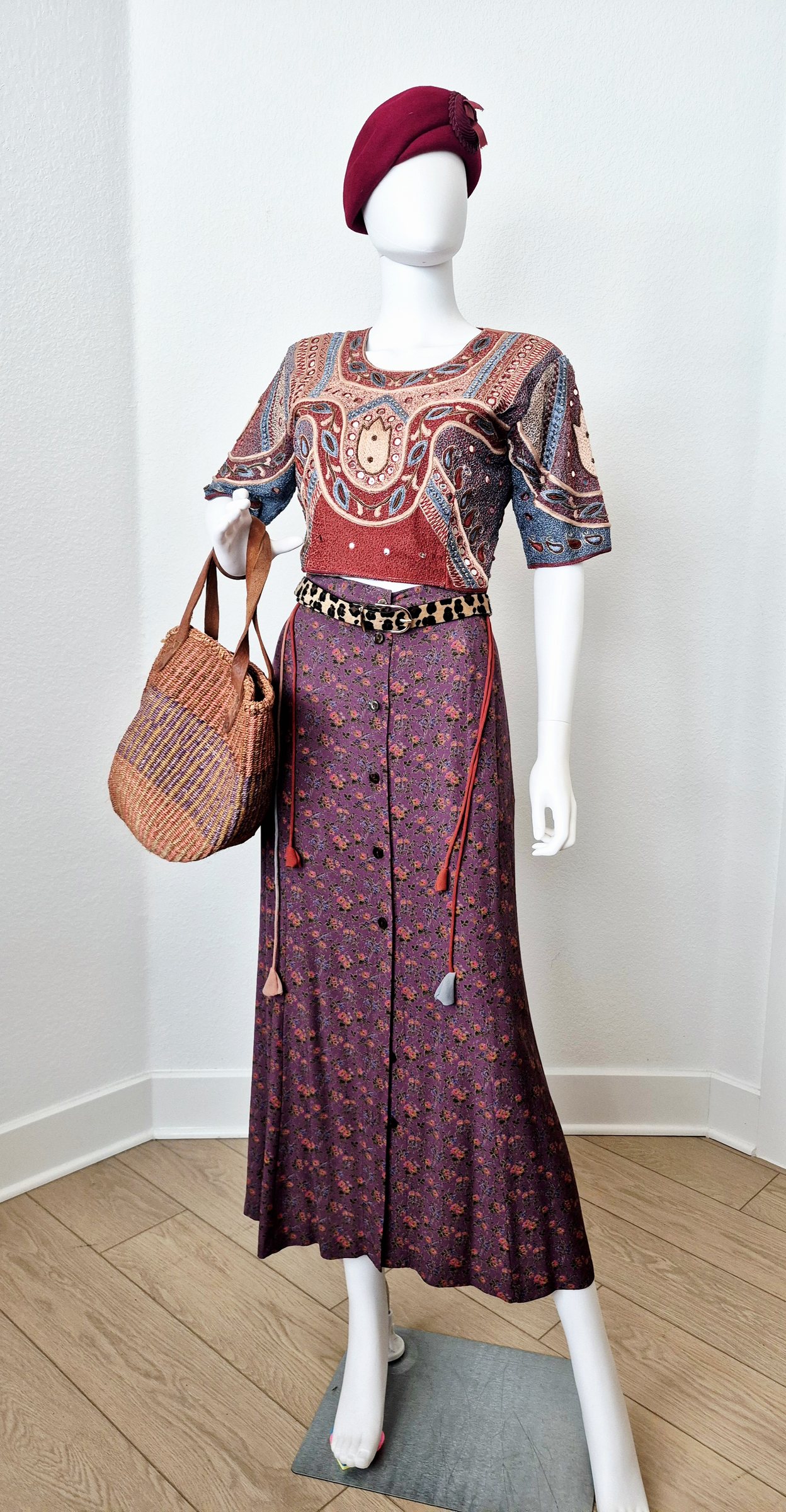 A burgundy vintage look with visible handwork and tactile details