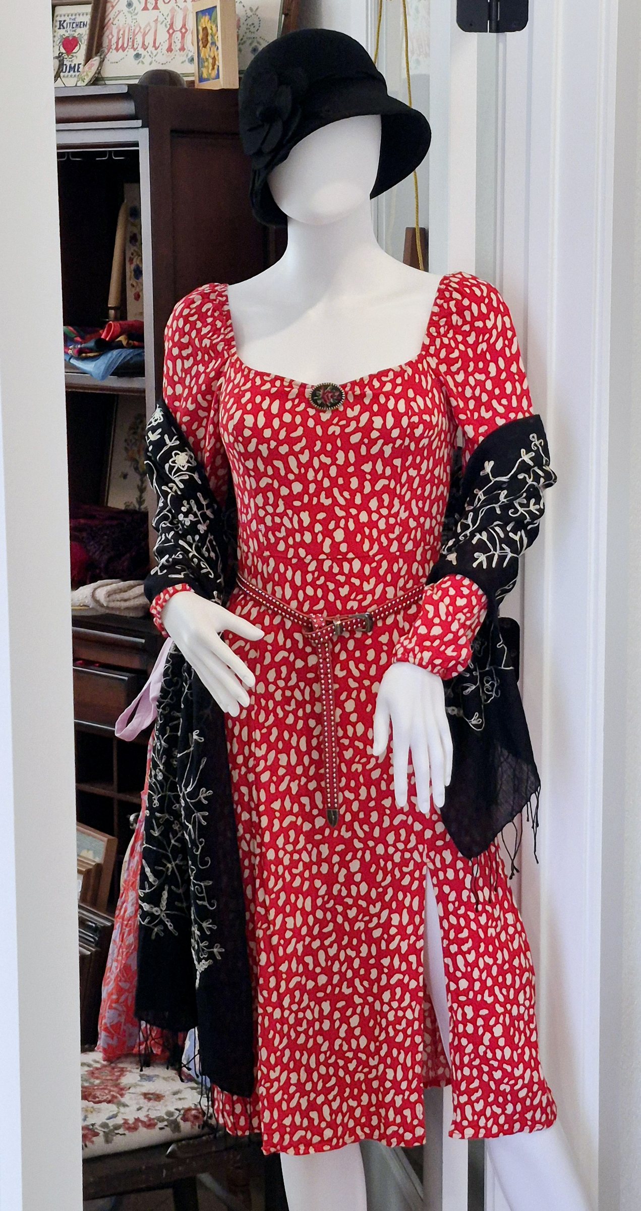 A red vintage dress edged with black accessories